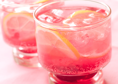 Pink lemonade in two glasses - True Lemon