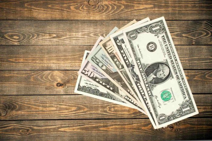 stack of class action rebates money