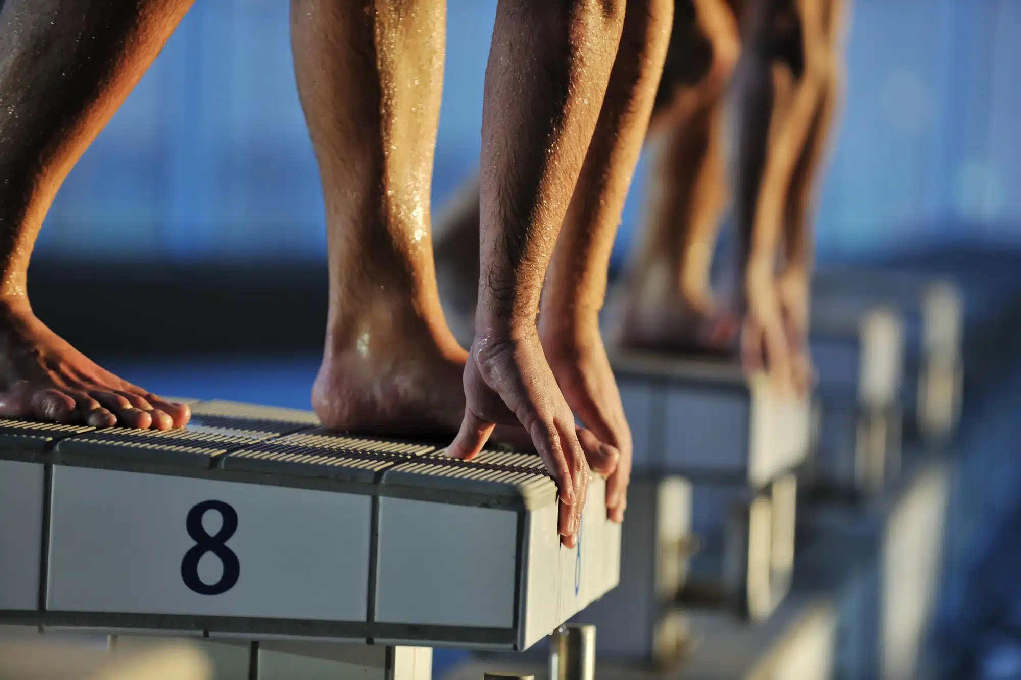 A onetime competitive athlete is suing former USA Swimming coach Scott MacFarland over allegations he raped her when she was 17.