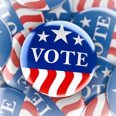 Red-white-and-blue "vote" button on faded background of the same button - election grant