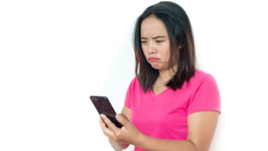 Unhappy woman reads text