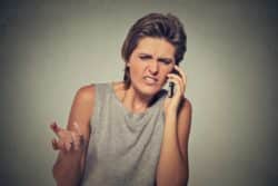 Annoyed woman on cell phone