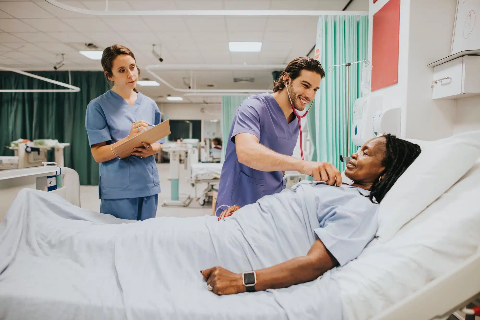 Doctor and nurse examine patient