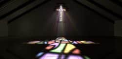 stained glass window in shape of the cross