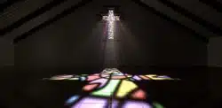 stained glass window in shape of the cross