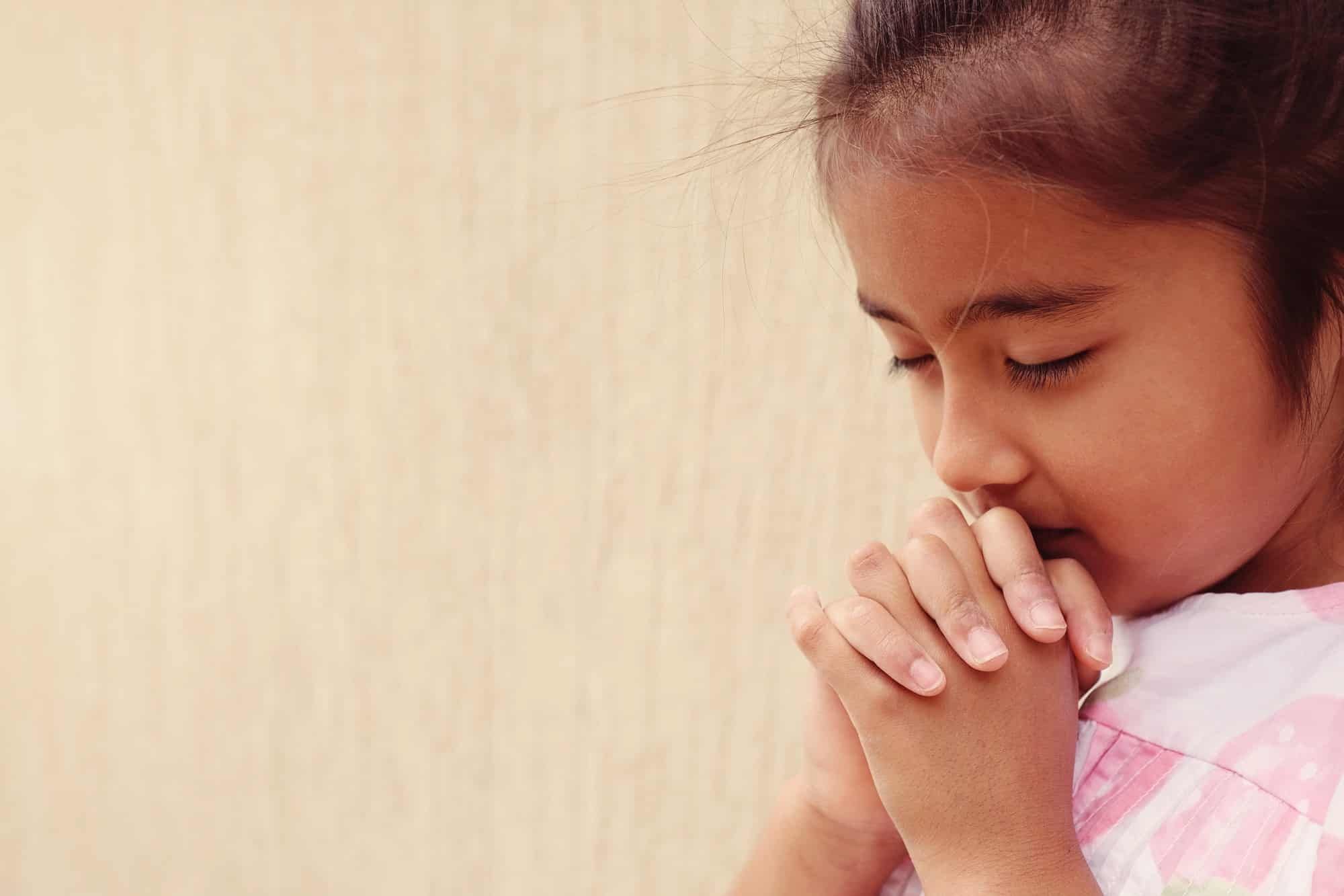 Young girl praying