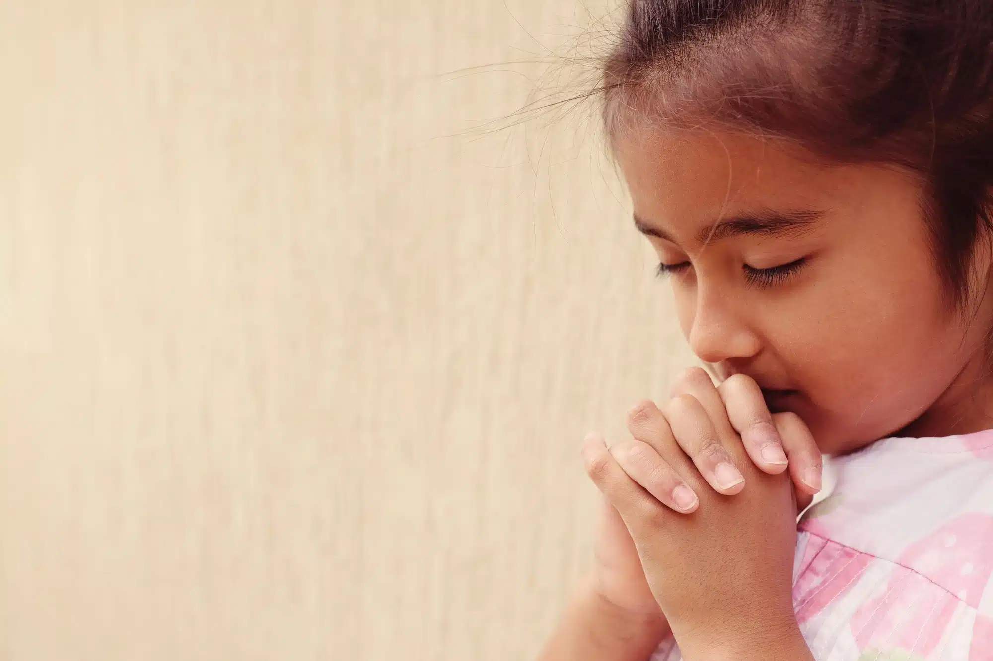 Young girl praying