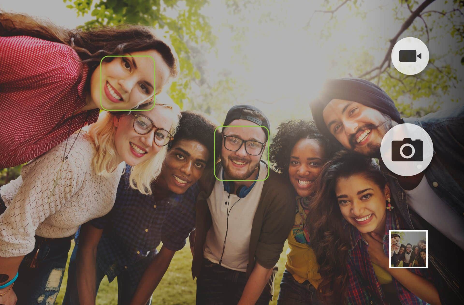 A group poses for a photo as the camera uses facial recognition - facial recognition software