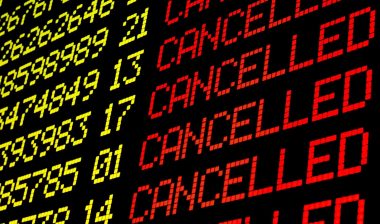 A airport flight status board shows several canceled flights - refund policy