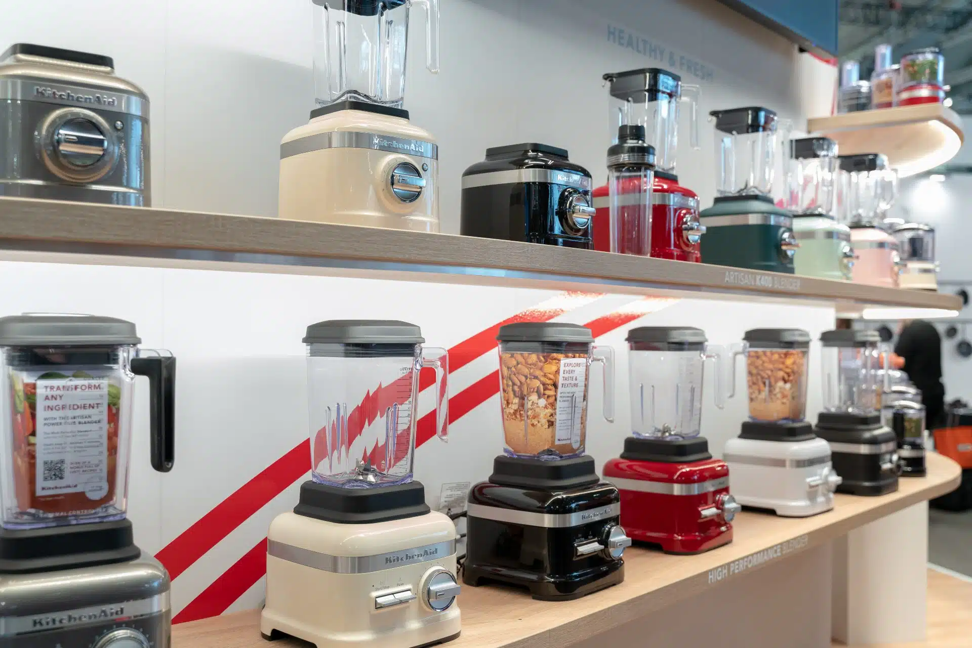 KitchenAid blenders sit on shelves