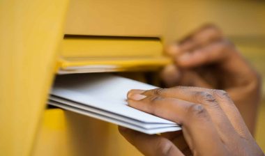 Person mailing ballots regarding the Supreme COurt decision not to extend Wisconsin Mail-In Ballot Deadline