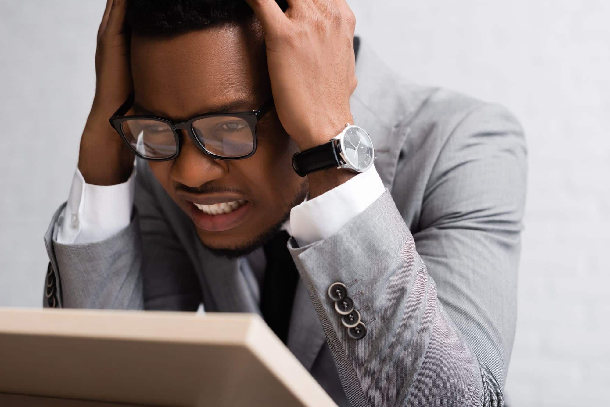 stressed black man lost money in stocks