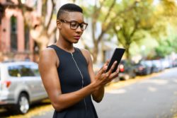Jogger reading real estate telemarketing text