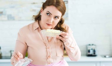 Woman inspecting butter regarding the Entenmann's All Butter Loaf Cake class action lawsuit