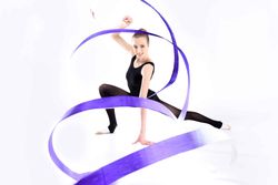 Female gymnast using ribbon in performance