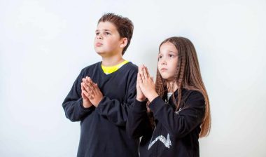 Little boy and girl praying