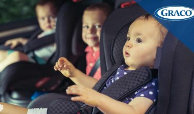 Children sit in car seats in the back of a vehicle - Graco car seats