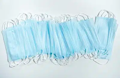 A line of blue medical face masks fanned out - sales tax