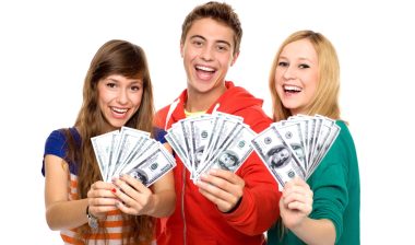 Two women and a man hold $100 bills - class action rebates