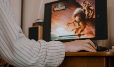 Low shot from behind of a person playing World of Warcraft - World of Warcraft website