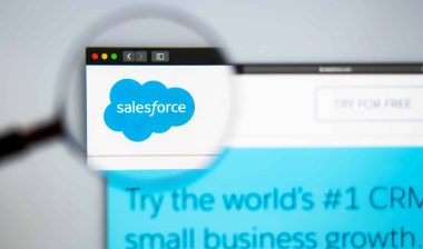 A magnifying glass magnifies the Salesforce logo on the company's website - data breach