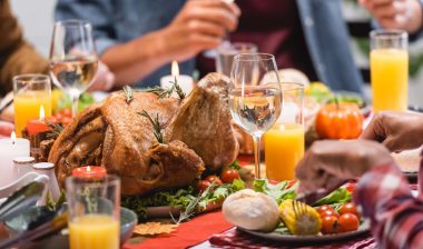 People sit around a table and eat - health alert