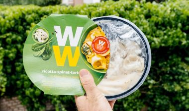man holding a prepared Weight Watchers meal