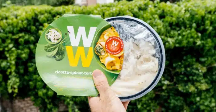 man holding a prepared Weight Watchers meal