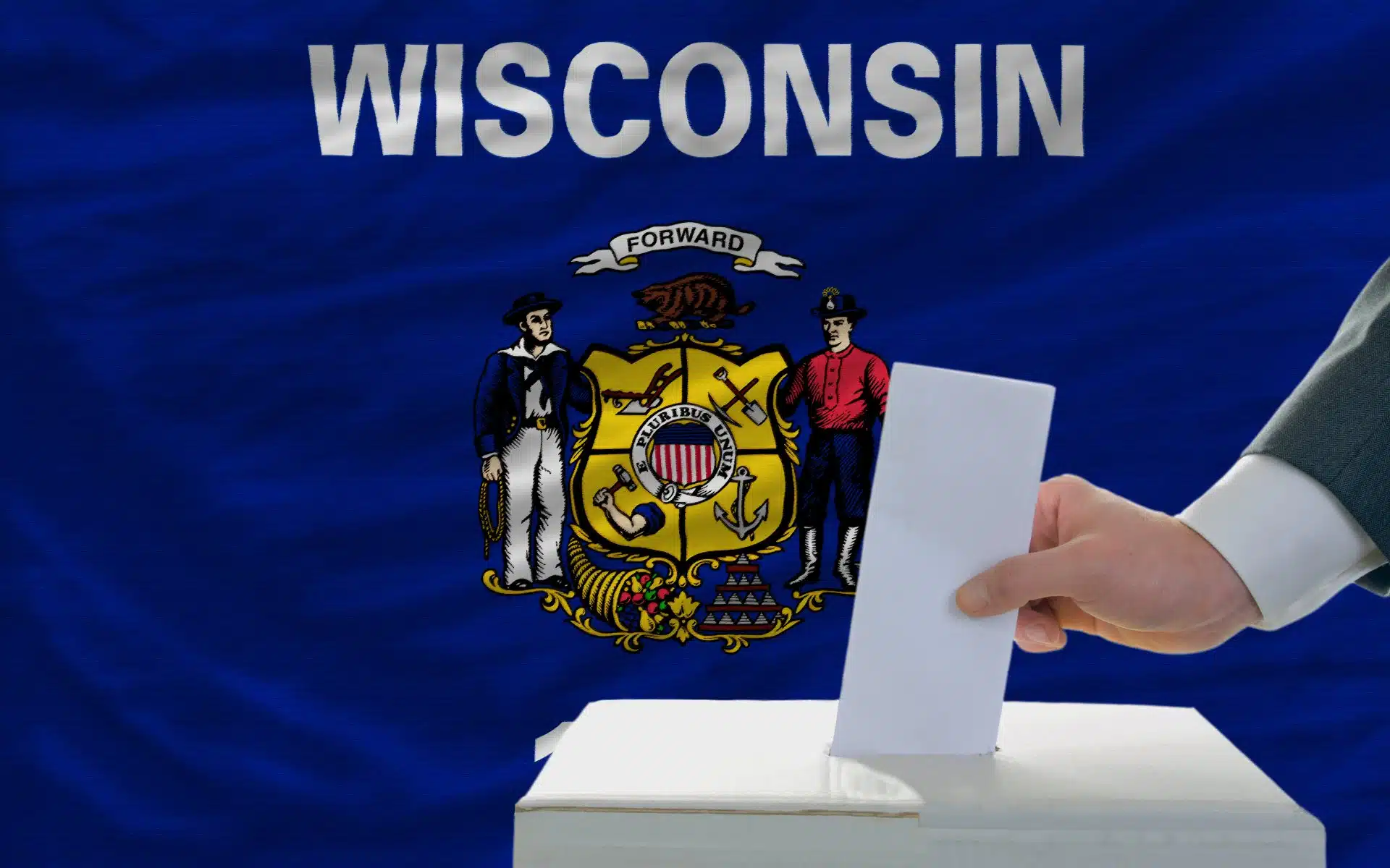 Man casts a ballot in front of a Wisconsin state flag - wisconsin voters