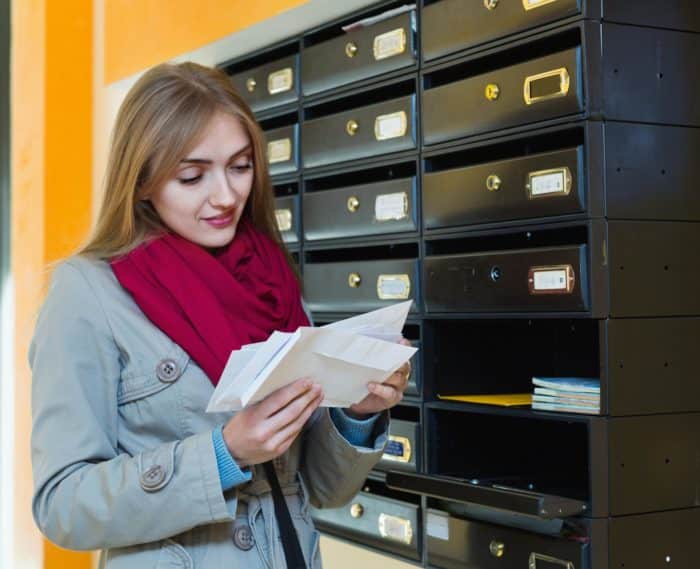 woman checking mailbox for FTC refund checks