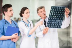 Medical staff looking at brain scan
