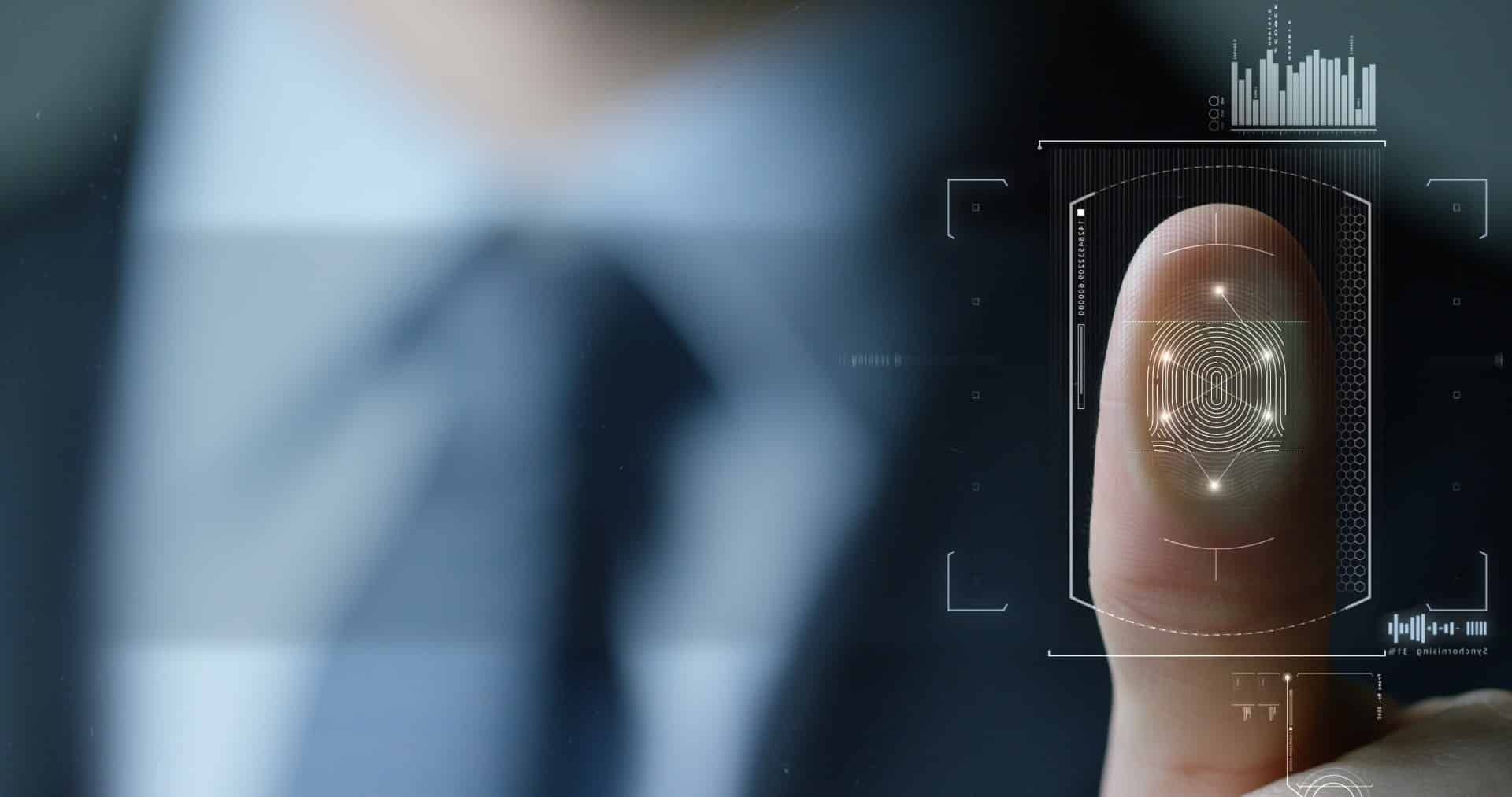 Closeup of man in suit and tie scanning his thumbprint - Ace Hotel Chicago
