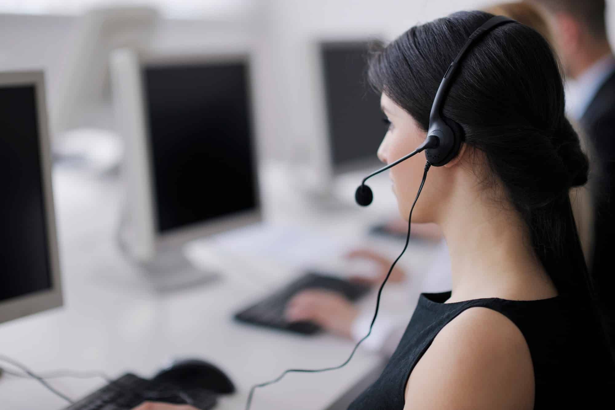Woman making phone solicitations