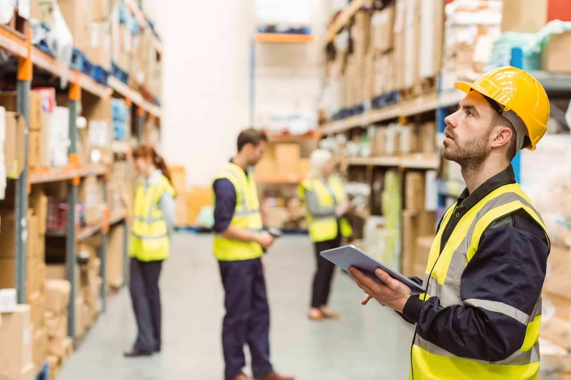 Warehouse workers in yellow vests - worker safety