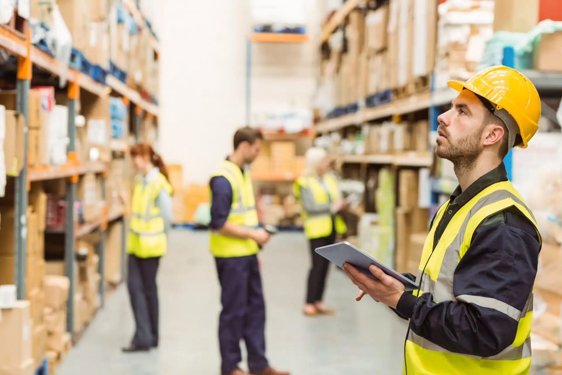 Warehouse workers in yellow vests - worker safety