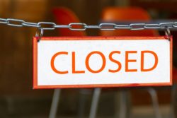 Closed business sign business interruption insurance companies to pay for COVID losses