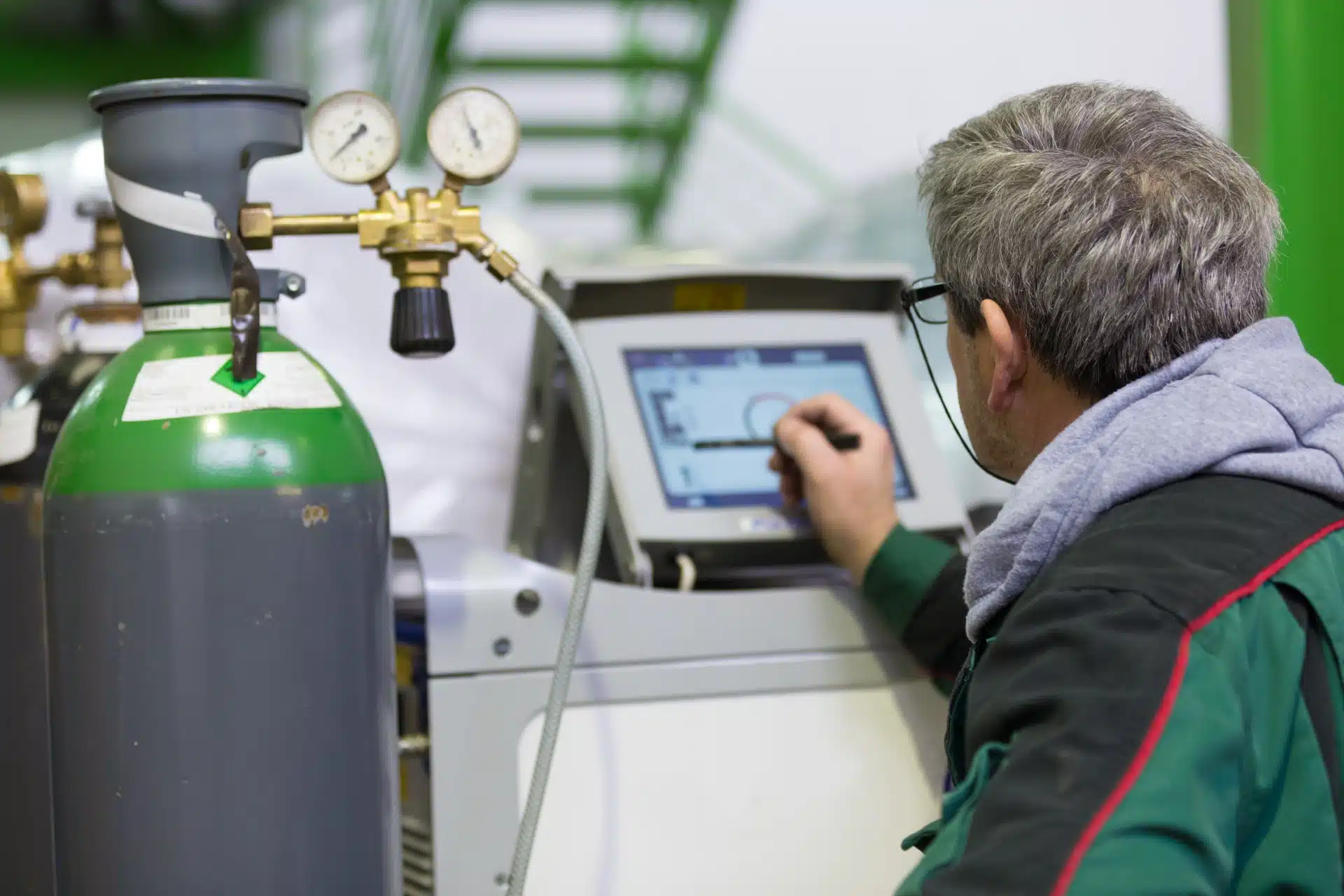 Industrial worker setting orbital welding machine - fuel surcharge