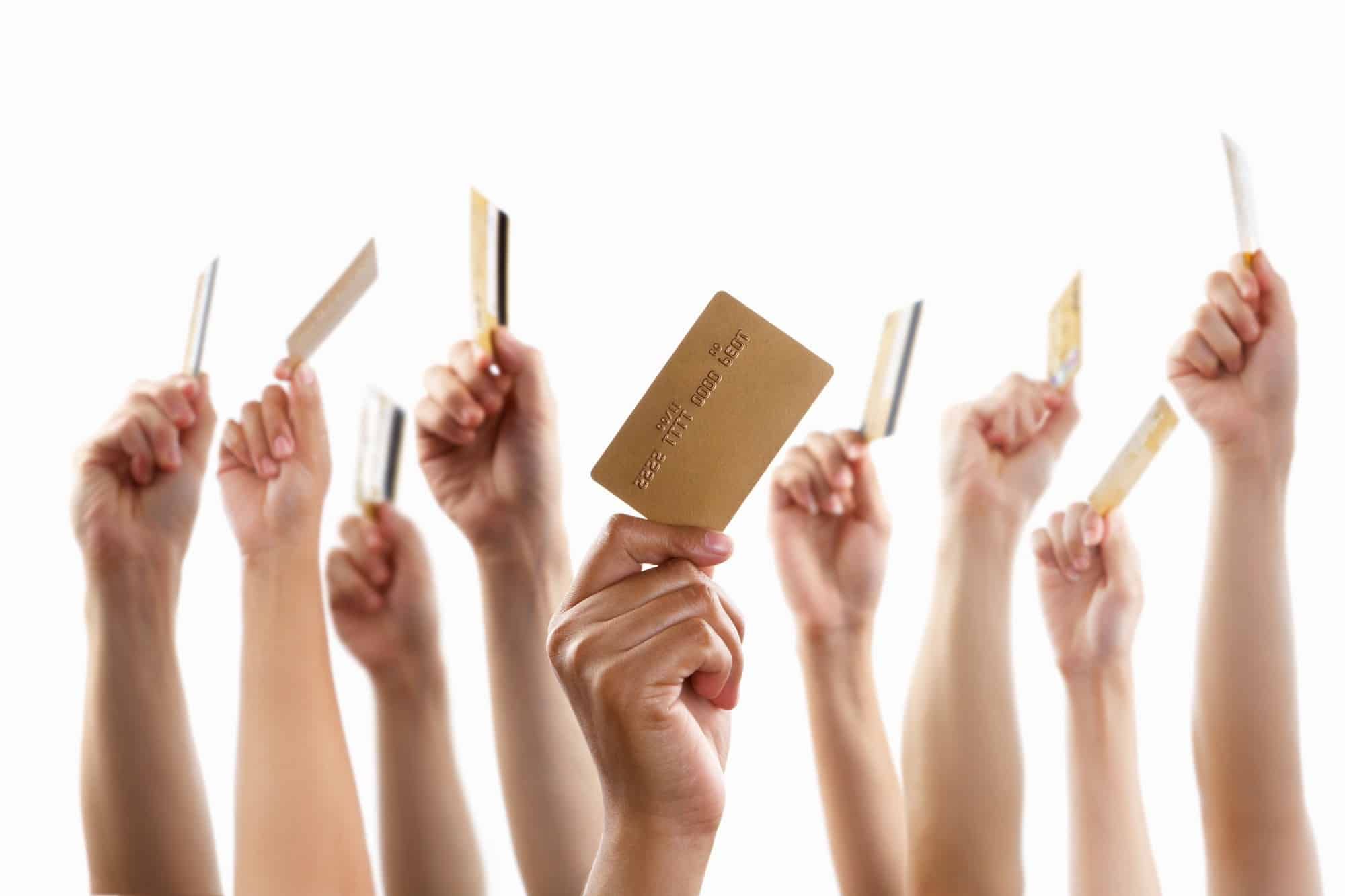 hands holding credit cards