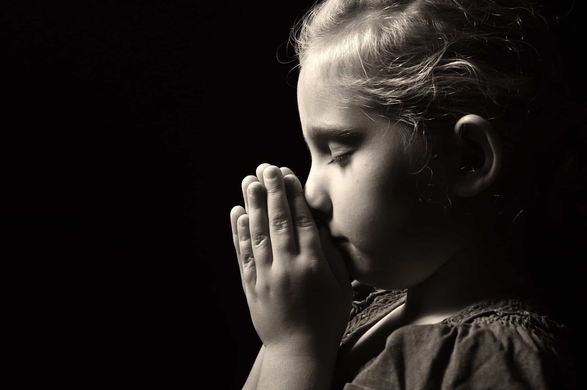 Girl praying over abuse in the LDS church
