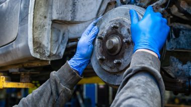 mechanic working on brakes