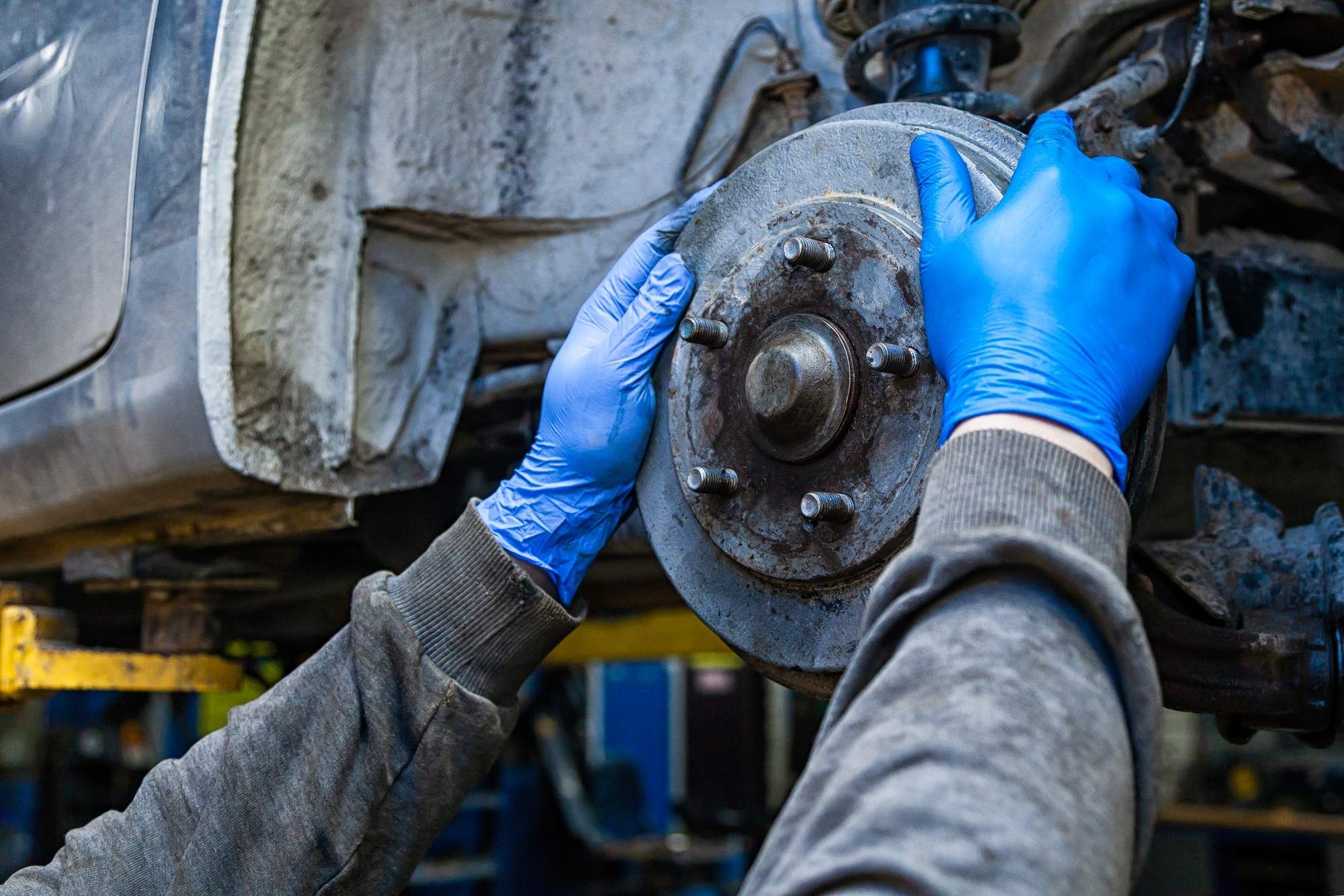 mechanic working on brakes