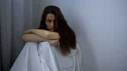 Woman waiting to be examined by doctor