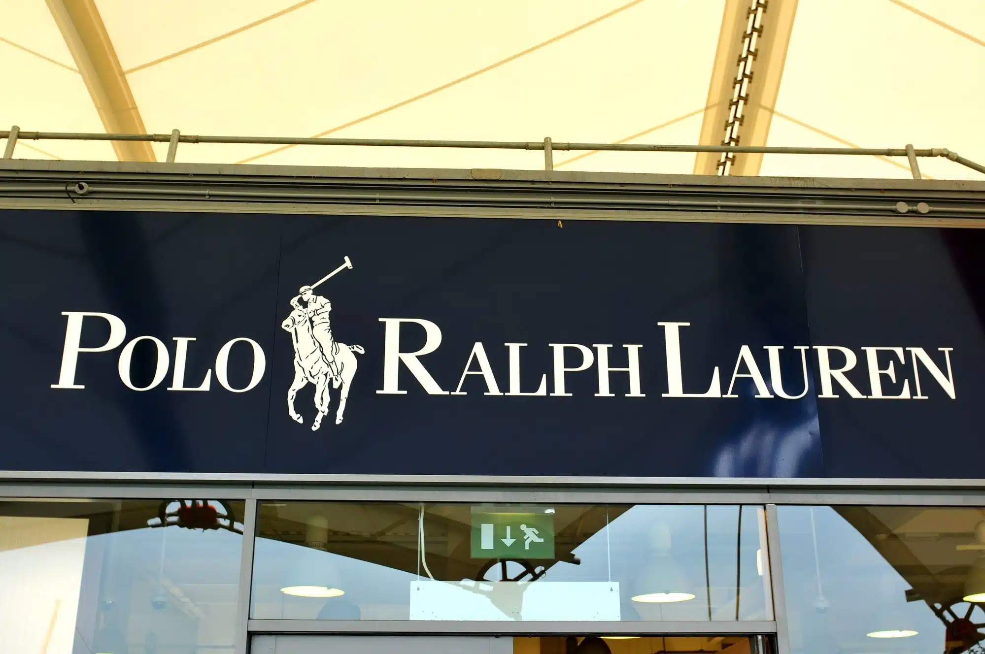Factory Mutual Insurance Co. says Ralph Lauren's $700 million property insurance policy doesn’t cover losses unless there’s a direct link to the virus.