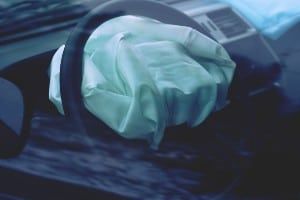 Deployed airbag on steering wheel - Takata airbag