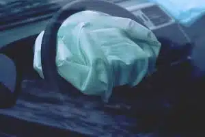 Deployed airbag on steering wheel - Takata airbag