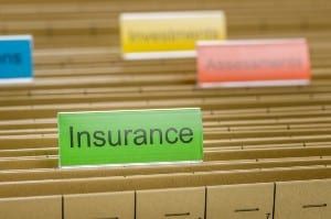 Hanging file folder with a green "Insurance" label tab - American General Life Insurance