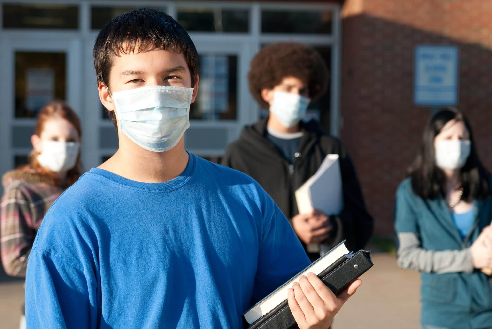 masked university students on campus - florida covid-19