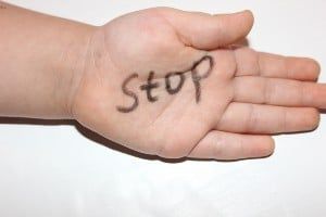 "Stop" written on child's palm - ymca