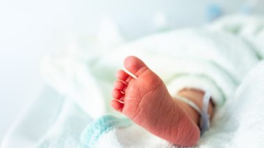 close up of infant foot in ICU