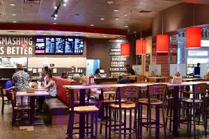 Dining area of a Smashburger restaurant - smashburger settlement
